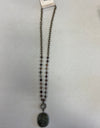 Gray beaded necklace with crystal and stone pendant