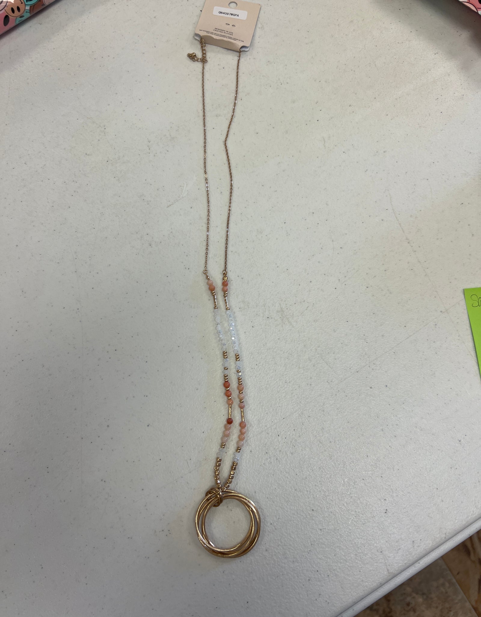 Coral head necklace with gold ring pendant