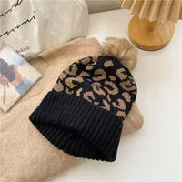 NI Black w/tan animal print pom hat