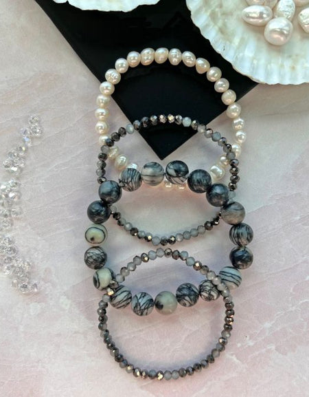 Cultured Pearl and Crystal set of Four Bracelets.